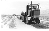 A black and white picture of a paving truck from 1934.