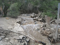 Water flows near U.S. 395 due to flooding in Independence in July, 2008.
