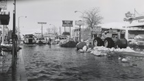 A black and white image from the 1960s of downtown Bishop with snow and flood waters.