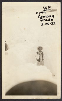A black and white photo from 1932 showing an unknown man standing in the snow near Conway Summit. Writing on the image reads "We open Conway Grade 3-25-32."