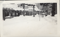 An undated black and white image of the Crestview Lodge covered in snow and icicles.