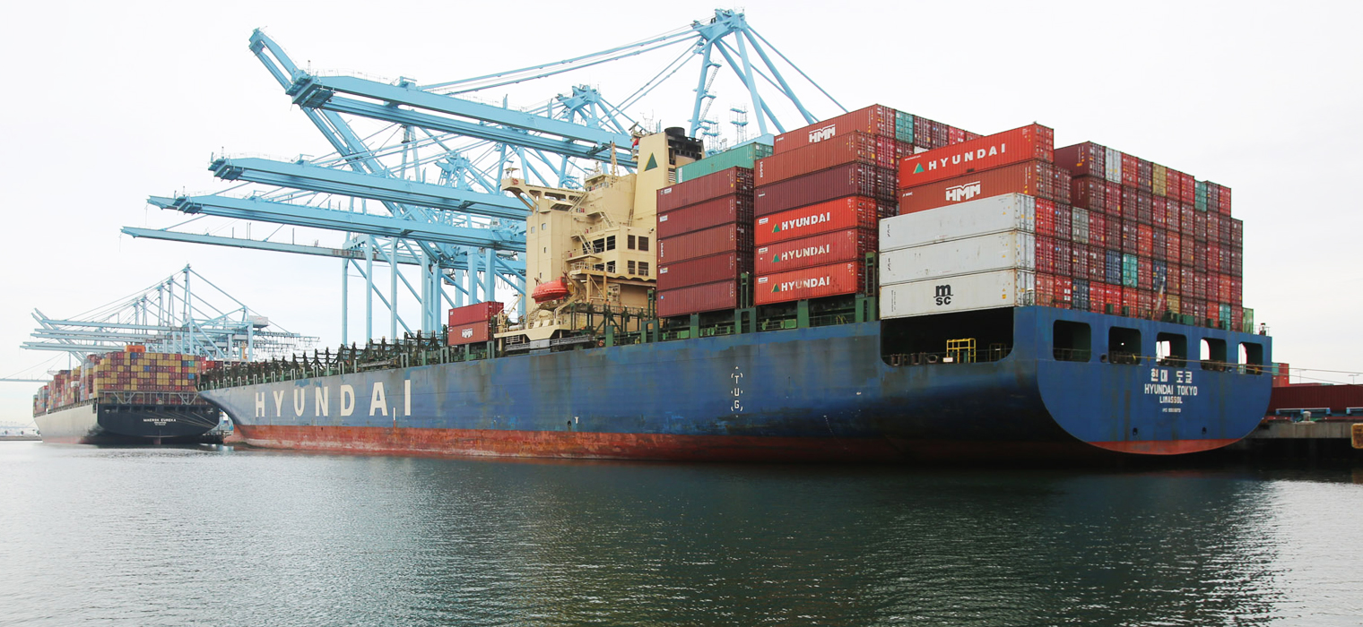 Photo showing a large cargo ship at the port of Long Beach