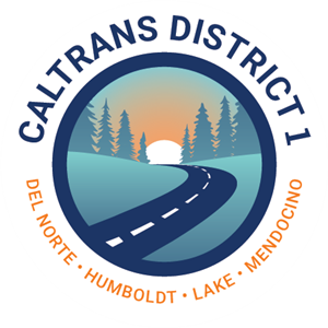 Caltrans District 1 shield. Humboldt, Del Norte, Lake, Mendocino. The sun sets over a road that winds from the foreground to the background. Mountains line each side.