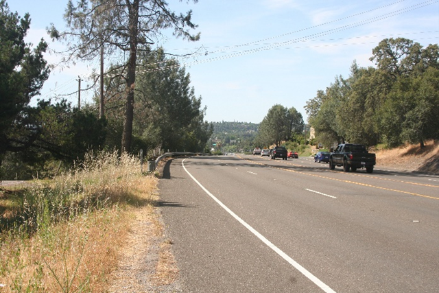 Photo of State Route 49 (facing south) between Palm Avenue and Marguerite Mine Road. Photo taken before Caltrans constructed a sidewalk, widened shoulder and retaining wall with concrete barrier for improved pedestrian and bicycle movement. 