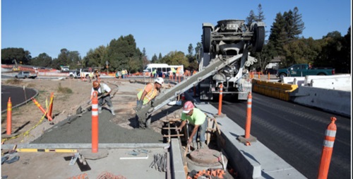 Crews perform final work and inspections prior to opening the new roundabout that accommodates traffic at the SR-29 freeway on- and off-ramps at First Street.
