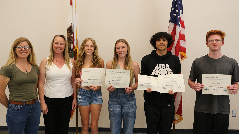 A photo of the 2024 Bishop High School Trig-Star competition winners, along with their teacher and a representative from Caltrans.