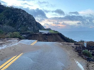 Photo from the morning of January 29, 2021, showing the washout of California's Highway 1, on the Big Sur Coast at Rat Creek, looking south. Debris flow from the Dolan Fire burn scar washed out a 150-foot section of roadway January 28, 2021, causing a full closure.