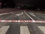pavement markings of arrows and "Do Not Enter" text on freeway ramps are visible only to wrong way drivers 