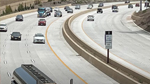 Freeway with a high-occupancy vehicle (HOV - aka "carpool") lane and free-flowing traffic