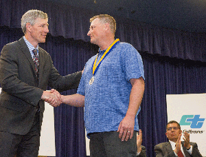 Caltrans Director Malcolm Dougherty shakes Maintenance Leadworker Dean Rouse’s hand after receiving the Governor’s Medal of Valor for rescuing a woman from the swift-moving Pit River in California’s northeastern corner in Modoc County on Dec. 20, 2015.