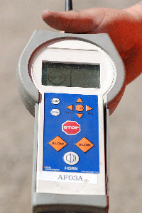 Caltrans workers can operate the flagging device safely from behind guardrail with this controller, but should be available to step in if the device malfunctions.