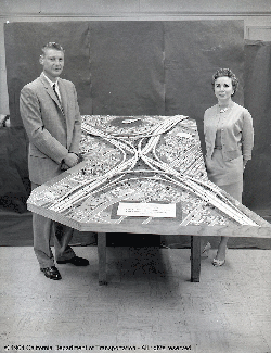 The late Peggy and John Unruh, who were draftsmen for the Division of Highways (now Caltrans), are pictured here with a model they made of the Santa Monica/San Diego Freeway Interchange.