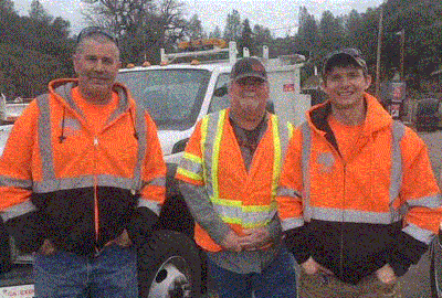Pictured left to right Platina Maintenance Crewmember Thomas “Dave” Britt, Supervisor Lonnie Swartout, and crewmember Ben Anderson rescued an injured man and woman who had driven off State Route 36 and tumbled 70 feet down a slope in the snow.