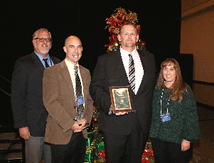 Pictured from left: Riverside County Deputy Director Keith Jones, Riverside County Program Chief Nicholas Crain, Caltrans District 8 Hazmat Manager Bill Kerr, and Riverside County Supervising Hazmat Materials Management Specialist Lisa Mitchell pose after awarding Kerr the “Doing The Right Thing’ award Dec.7.