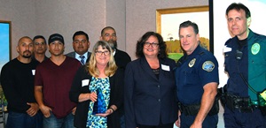 From left: Caltrans Equipment Operator 2 Victor Villanueva, Highway Maintenance Workers Roy Moreno and Frank Ortega, Landscape Maintenance Leadworker Salvador Lopez-Zamora, Maintenance Supervisor Paula Kilgore-Voight, Highway Maintenance Worker David Ramirez, Santa Barbara Mayor Cathy Murillo, and city of Santa Barbara Police Officers Craig Burleigh and James Ella. 