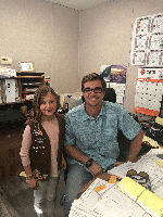 Caltrans Senior Construction Engineer Jason Kline gave Girl Scout Isabella Raffetto a tour of the construction office after she gave him and his crew cookies as a thank you for clearing the Montecito mud slides off the local highways.