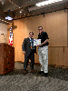Maintenance Division Chief Tony Tavares, left, presented Headquarters Customer Service Officer Patrick Olsen with the Maintenance Gold Partnering Award for communicating, refining and streamlining the Customer Service Request process in partnership with 12 districts.
