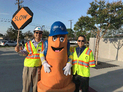 From left to right: Caltrans Associate Transportation Planner Cuong Phu Trinh, Caltrans District 8 Mascot “Cone Kid”, and Rancho Cucamonga city Traffic Engineer Albert Espinoza encouraged and educated Los Amigos Elementary students at their Walk to School Day event.