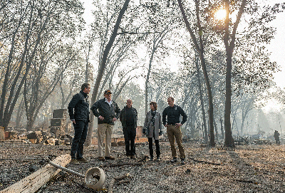 From left to right: Gov.-elect Gavin Newson, President Donald Trump, Gov. Jerry Brown, Paradise Mayor Jody Jones and Federal Emergency Management Agency Director Brock Long tour the Skyway Villa Mobile Home and RV Park during Trump’s visit of the Camp Fire in Paradise on Nov. 17.