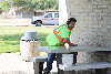 Howard Training Center worker Dustin Benge cleans picnic tables at the southbound State Route 99 Turlock Rest Area.