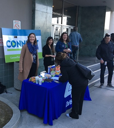 Caltrans headquarters’ inaugural Try Transit Month included tabling at “Transit to Work Day” on March 21 at the light-rail stop behind the building. Facing the camera are, from left, Shannon Simonds, Emily Abrahams, Ali Doerr and Anthony Serna.