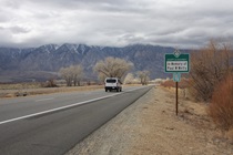 A few miles north of Bishop is one of the many examples of Adopt-A-Highway signs that pepper the fringes of U.S. Highway 395.