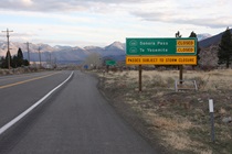 A few miles shy of the Nevada border, this sign for southbound motorists suggests that if they want to cross the Sierra Nevada, they should either turn around or expect to do a very long loop around the range's southern edge.