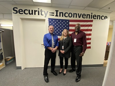 Superior Accomplishment Award winners Mark Sproul, left, and Ervin Pridgen flank their supervisor, Allison Harris, in the Statewide Operation Services office at Caltrans Headquarters in downtown Sacramento.