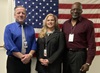 Superior Accomplishment Award winners Mark Sproul, left, and Ervin Pridgen flank their supervisor, Allison Harris, in the Statewide Operation Services office at Caltrans Headquarters in downtown Sacramento.
