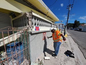 Caltrans engineer Herby Lissade red-tags a building after the Puerto Rico earthquakes of 2019-20