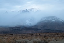 Snow dusts and clouds linger over the Eastern Sierra Nevada range. (Photo by Christopher Andriessen)