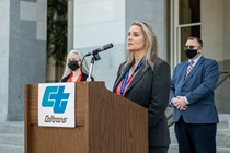 Tamie Mcgowen speaks, and behind her are Annalene Myers and  Joe Rouse at the Caltrans Workers Memorial 2021 (Photo by Headquarters)