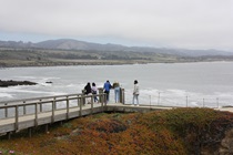 A few hundred feet inland from Pigeon Point Lighthouse, visitors gather to gaze at the Pacific Ocean and points south.