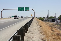On its western approach to Fresno, Highway 180 morphs into a freeway. At right, in the distance, downtown Fresno peeks out.