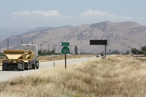 Not far east of Fresno, State Route 180 is still flat, but hills and mountains come into view (air quality permitting).