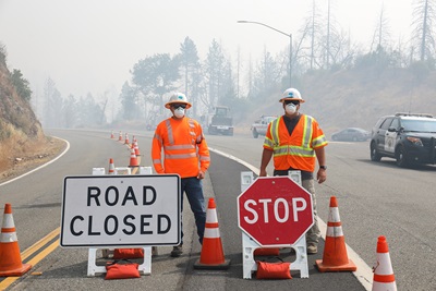 Steve Brummett and PJ Huckabay, from Grass Lake Maintenance, working on the Tennant Fire. Photo taken by PIO Haleigh Pike. 