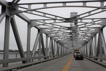 The metallic and historical Rio Vista Bridge towers over the Sacramento River and keeps State Route 12 traffic flowing.