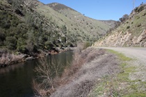 Here's a view of the Merced River looking eastward. To the left, across from the highway, is a ledge on which the Yosemite railway used to run.