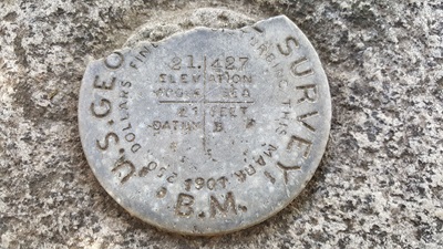 The brass disk that is on top of the Capitol survey monument. 