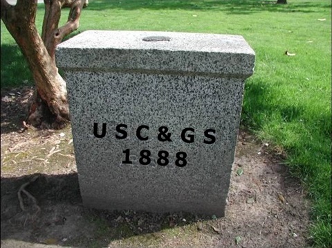 The Capitol survey monument with the letters and numbers of its aged engraving superimposed atop the image. 