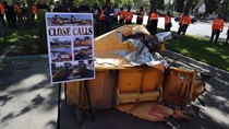 Crashed attenuator and Close Call photo board on display at Fresno Memorial held April 20.