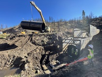 In District 10, Crews installed a 120-foot long, 8-foot diameter culvert on State Route 89 north of Markleeville after a storm caused flashing flooding and debris flows. Caltrans installed the culvert and reopened State Route 89 to one-way traffic in less than two weeks.