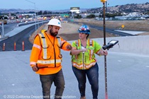 In District 4, Marcus Esparza, left, consults with a roadway worker in the Bay Area. (Photo by John Huseby)