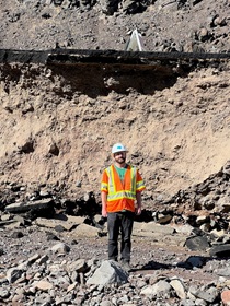 In District 9, public information officer Michael Lingberg stands among damage sustained along State Route 190 near Death Valley. (Photo by Christopher Andriessen)