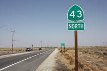 The pretty-flat roadway begins its northern journey at a roundabout with SR-119; there are several other roundabouts along the way.