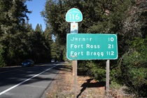 All three towns listed on this SR-116 sign are accessed most directly via State Route 1.