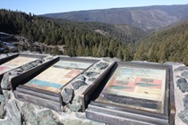 These signs describe the northern view off the parking lot of the first of two vista points on the road from Nevada City toward Yuba Pass.