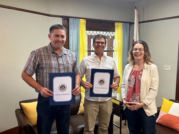 Medal of Valor recipients Templeton Area Maintenance Superintendent Cody Collins (left) Transportation Engineering Technician Jeff Scardine (center) and Assembly Member Dawn Addis during a presentation in her San Luis Obispo office.