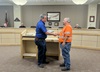 At an Amador Fire department board meeting in December, Jeff Brown (left), chairman of the Board of Directors, presents District 10 worker Paul Brager with a certificate of gratitude. Brager’s work partner in the fire-rescue effort, Mike Quinones, was not able to attend.