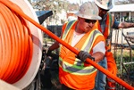 Leadworker John Frank guiding the jet rodder hose into the culvert. Placing his hands on the hose helps him know if the hose is hitting any kind of debris or getting snagged up on anything.